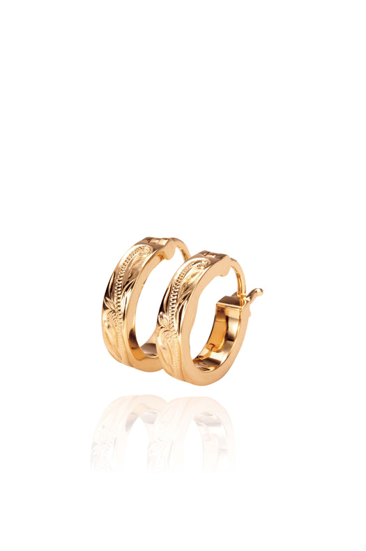 The picture shows a pair of 14K yellow gold mini hoop earrings with scroll engraving.