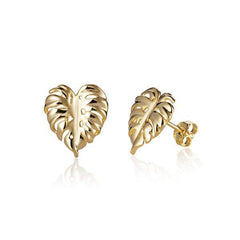 In this photo there is a pair of 14k yellow gold monstera stud earrings.
