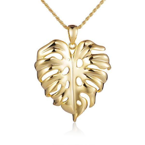 In this photo there is a yellow gold monstera pendant.
