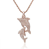 The picture shows a 14K solid rose gold 2 dolphin pendant with diamonds.