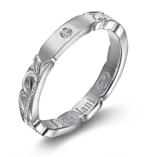 The picture shows a 14K white gold diamond 3mm ring with hand engravings including a diamond.