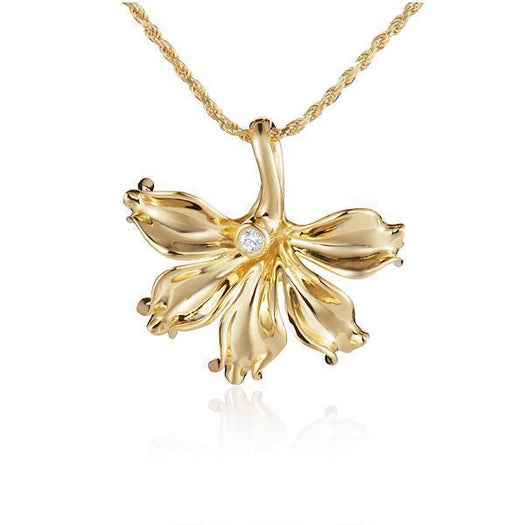 In this photo there is a yellow gold naupaka flower pendant with one diamond.