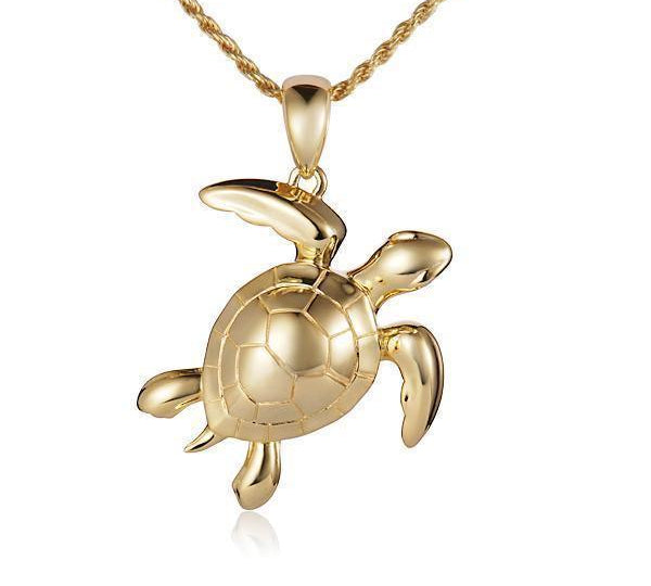 The picture shows a 14K yellow gold sea turtle pendant.