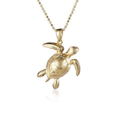 The picture shows a 14K yellow gold sea turtle pendant.