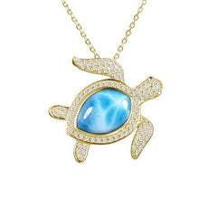 The picture shows a 14K yellow gold sea turtle pendant with a larimar gemstone and diamonds.