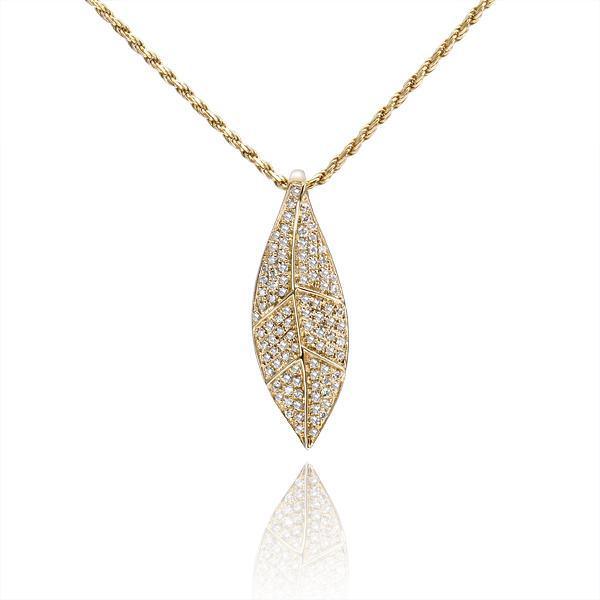 In this photo there is a yellow gold maile leaf pendant with diamonds.