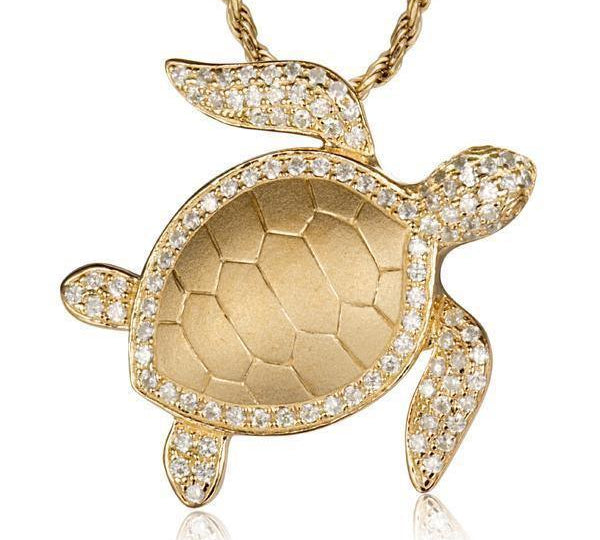 The picture shows a 14K yellow gold sea turtle pendant with diamonds.