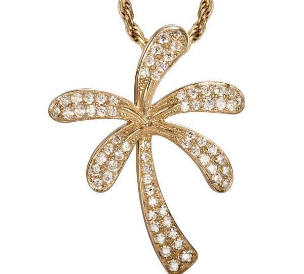 In this photo there is a yellow gold palm tree pendant with diamonds.