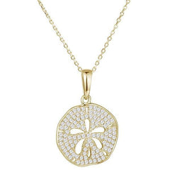 The picture shows a medium 14K yellow gold pavé sand dollar pendant with diamonds.