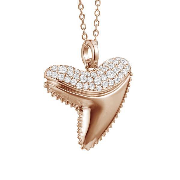 The picture shows a 14K rose gold shark tooth pendant with pavé diamond.