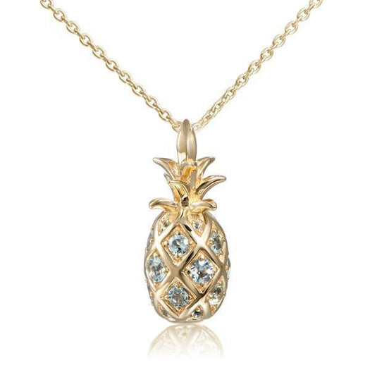 In this photo there is a yellow gold pineapple pendant with aquamarine gemstones.