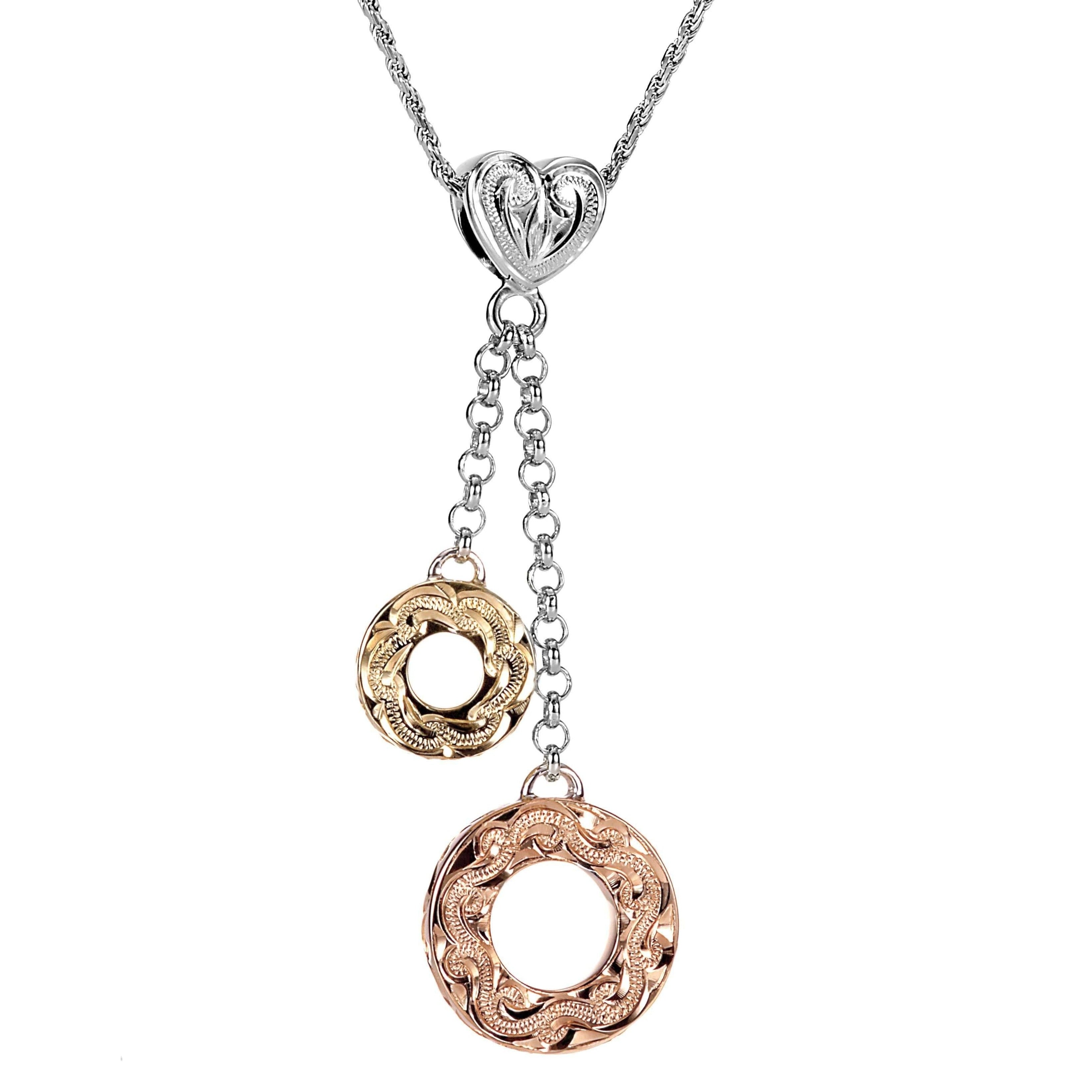 The picture shows a 14K rose and yellow gold two circles and one heart charm pendant with hand engravings.