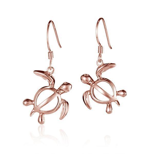 The picture shows a pair of 14K rose gold sea turtle hook earrings.