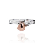 The picture shows a 14K rose gold and 925 sterling silver heart ring with hand engravings.