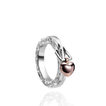 The picture shows a 14K rose gold and 925 sterling silver heart ring with hand engravings.