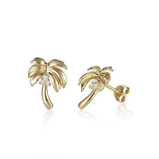 In this photo there is a large pair of 14k yellow gold palm tree stud earrings with diamond coconuts.