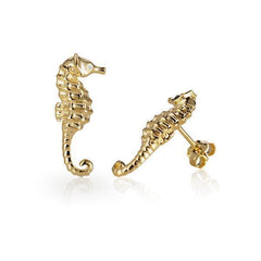 The picture shows a pair of 14K yellow gold seahorse stud earrings with diamonds.