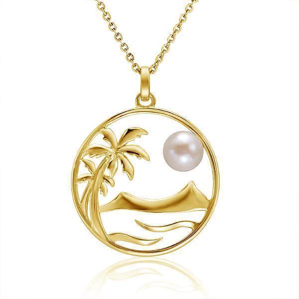 In this photo there is a yellow gold circle pendant with palm trees, diamond head mountain, ocean waves, and one white pearl.