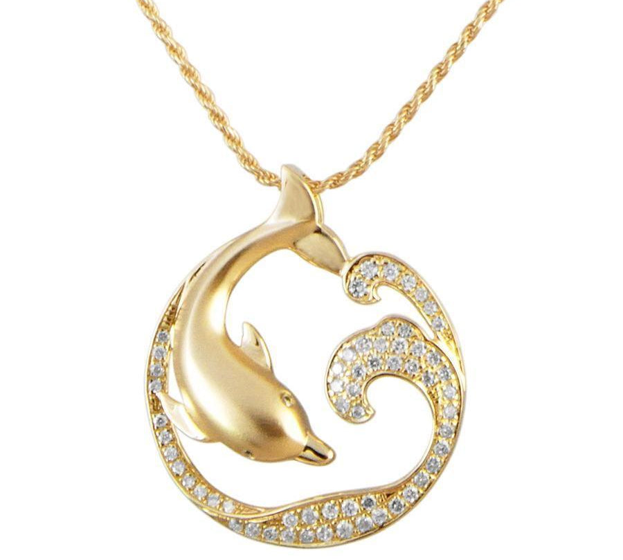 The picture shows a large 14K yellow gold dolphin and wave pendant with diamonds.