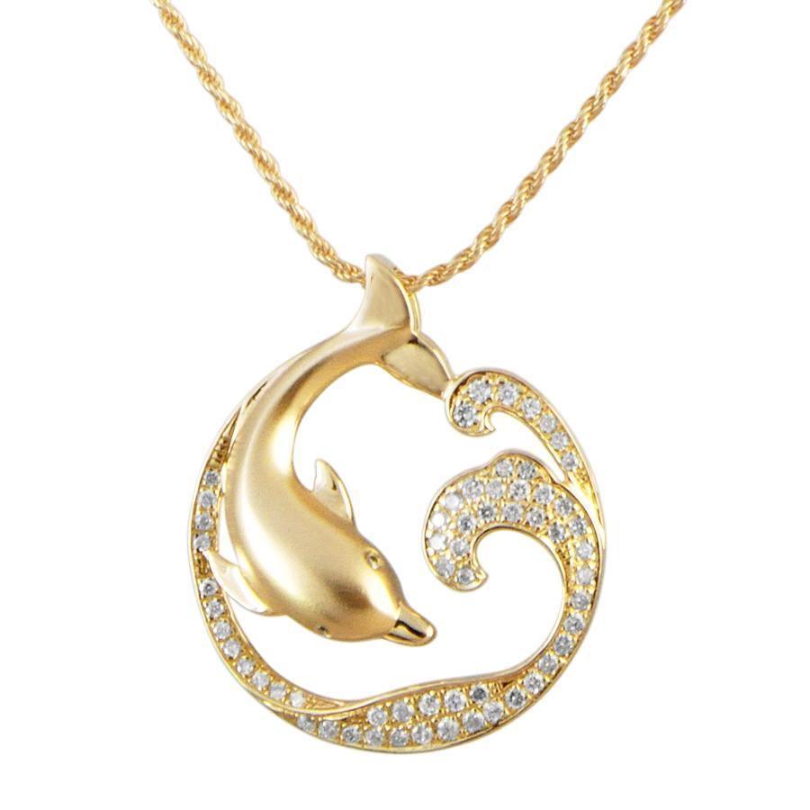 The picture shows a large 14K yellow gold dolphin and wave pendant with diamonds.