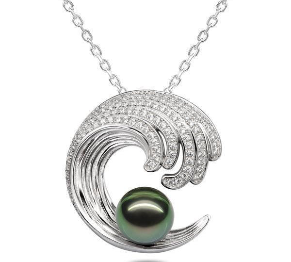 In this photo there is a white gold wave pendant with diamonds and one dark green pearl.