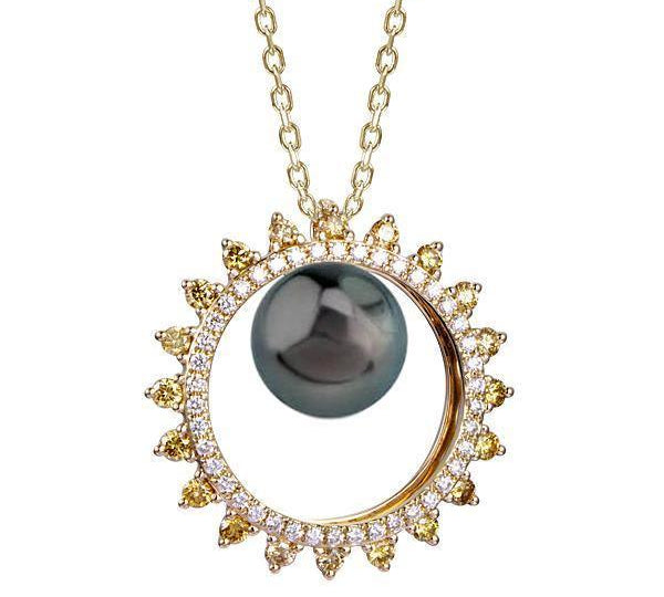 In this photo there is a yellow gold sun pendant with yellow and white diamonds and one dark pearl.