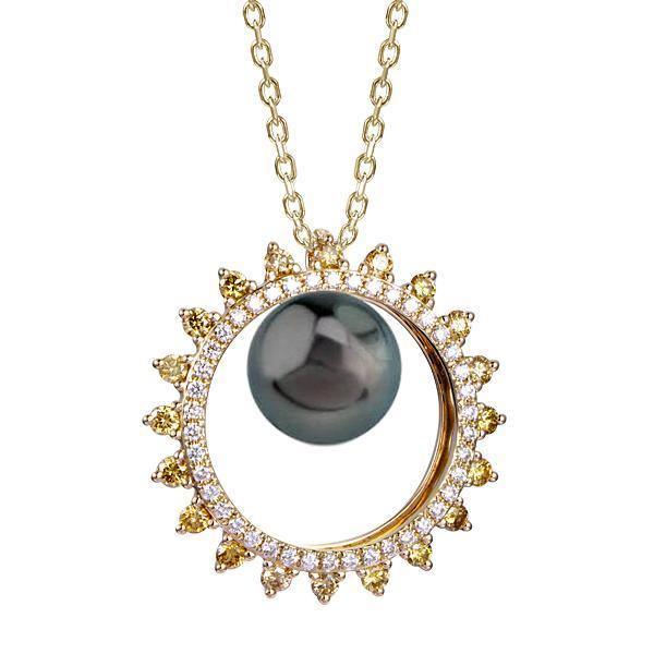 In this photo there is a yellow gold sun pendant with yellow and white diamonds and one dark pearl.