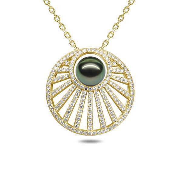 In this photo there is a yellow gold sun rays pendant with one dark green pearl and lined with diamonds.
