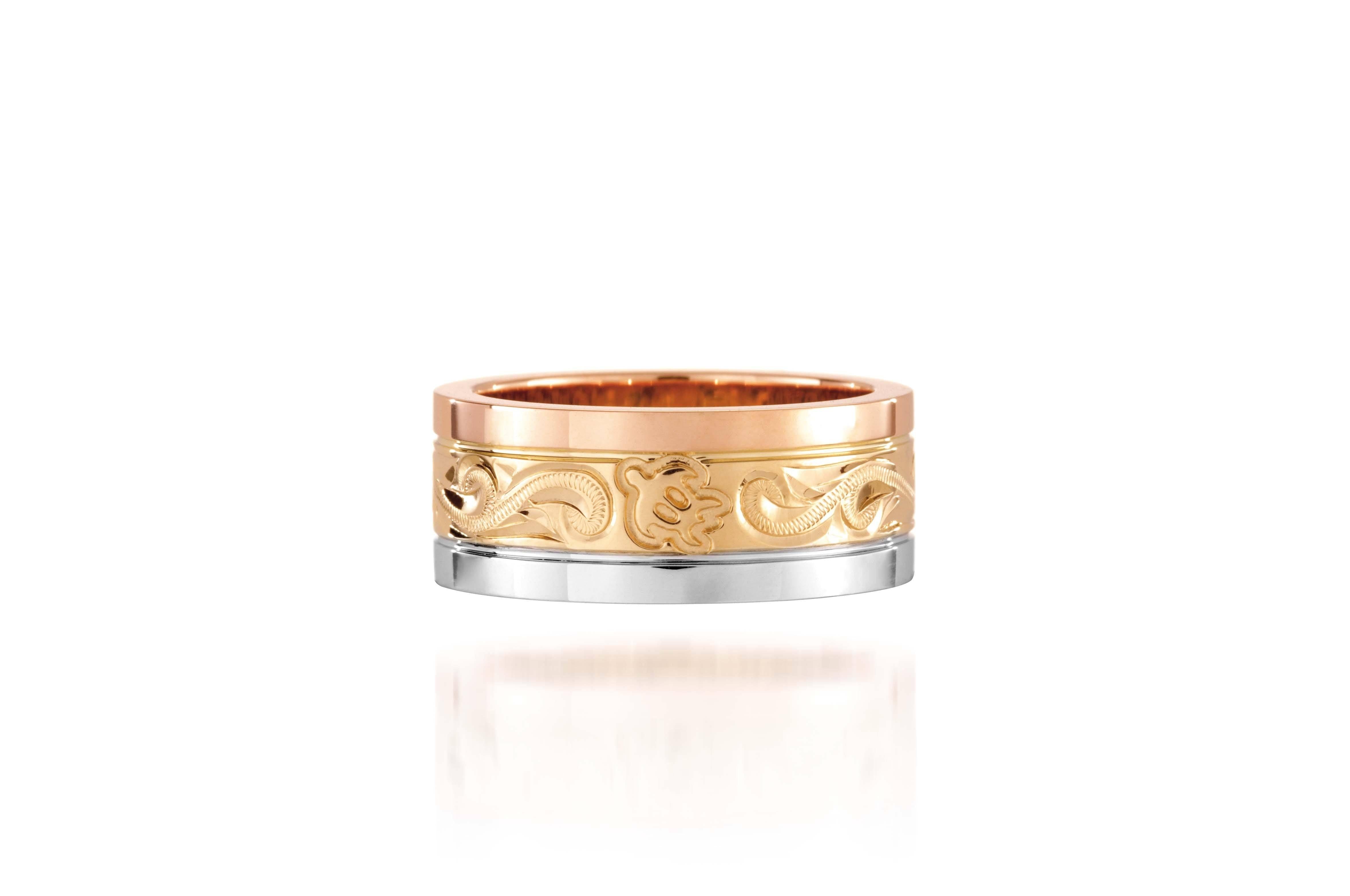 The picture shows a 14K rose, yellow, and white gold tricolor 8mm ring with hand engravings including sea turtles.