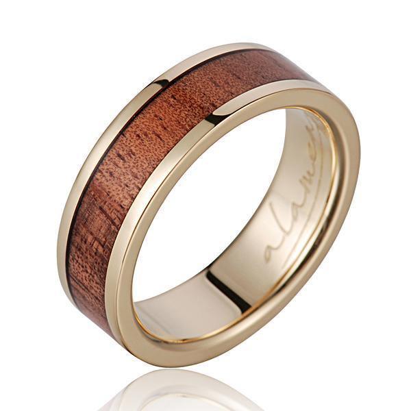 In this photo there is a 14K yellow gold and tulip poplar wood ring.