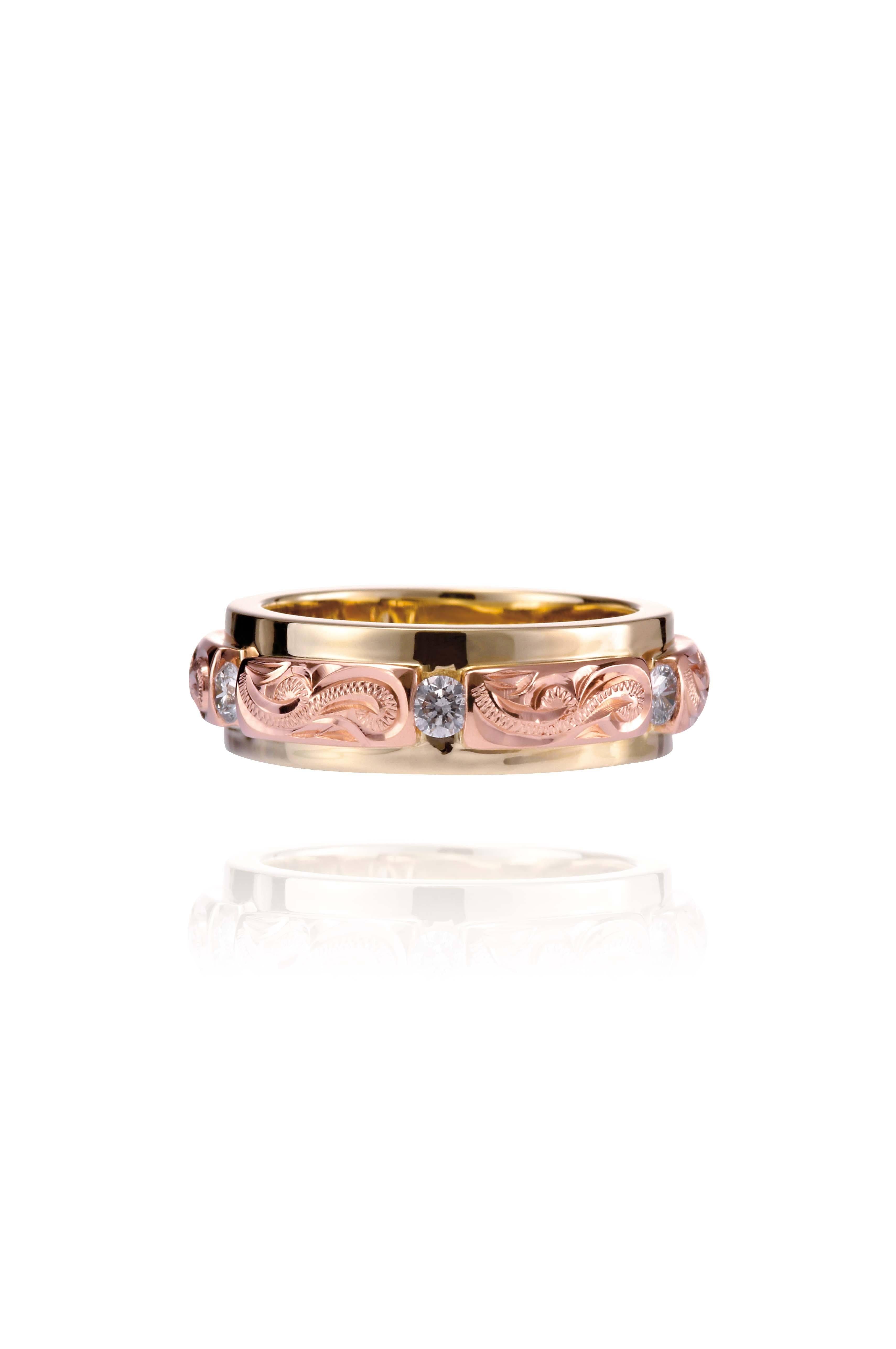 The picture shows a 14K yellow and rose gold two-tone infinity ring with diamonds and hand-engravings.