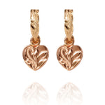 The picture shows a pair of 14K yellow and rose gold two-tone heart earrings with scroll engraving.