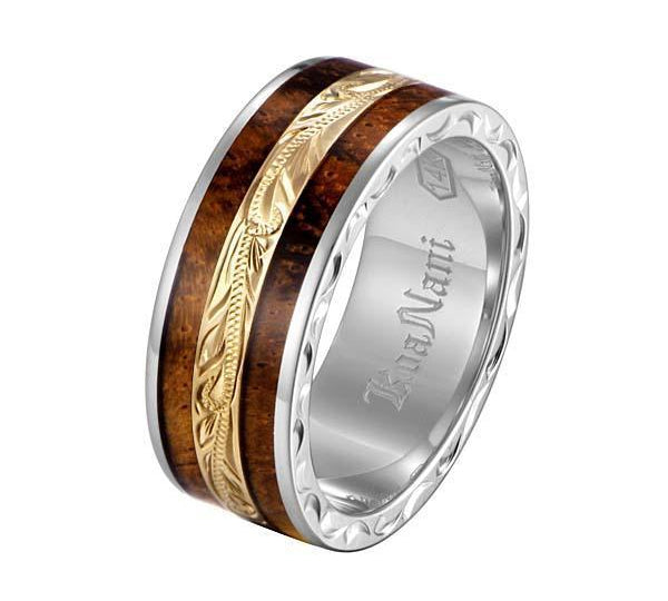 In this photo there is a white and yellow gold two-tone koa wood ring with scroll hand engravings.