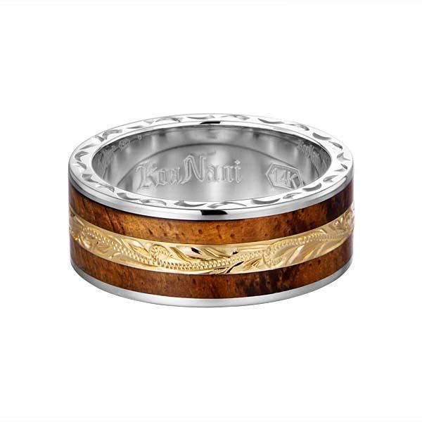 In this photo there is a white and yellow gold two-tone koa wood ring with scroll hand engravings.