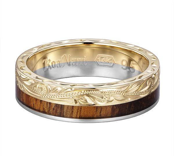 In this photo there is a white and yellow gold two-tone koa wood ring with scroll hand engravings.