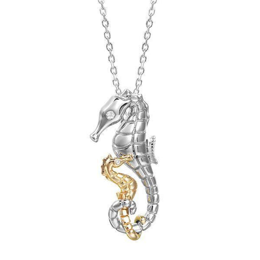 The picture shows a 14K white and yellow gold two-tone two seahorse pendant with diamonds.