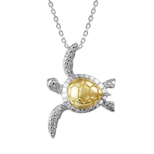 The picture shows a 14K yellow and white gold sea turtle pendant with two diamonds.