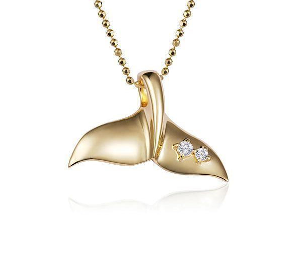 The picture shows a 14K yellow gold whale tail pendant with two diamonds.