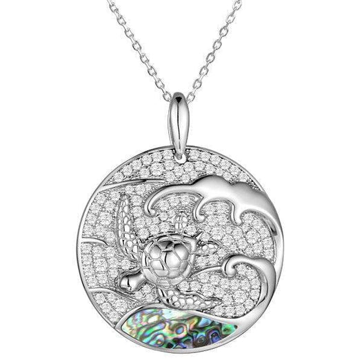 Sterling silver medallion pendant with a turtle swimming away from the abalone tides. 