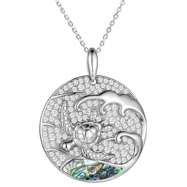 Sterling silver medallion pendant with a turtle swimming away from the abalone tides. 
