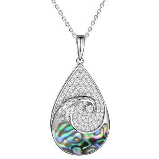 Sterling silver tear drop pendant with and abalone wave against the topaz sky. 