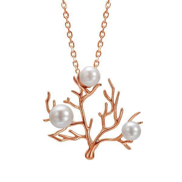 In this photo there is a small 14K rose gold coral pendant with three white pearls.