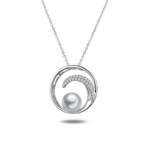 In this photo there is a white gold circle pendant with a wave, diamonds, and one white Akoya pearl.