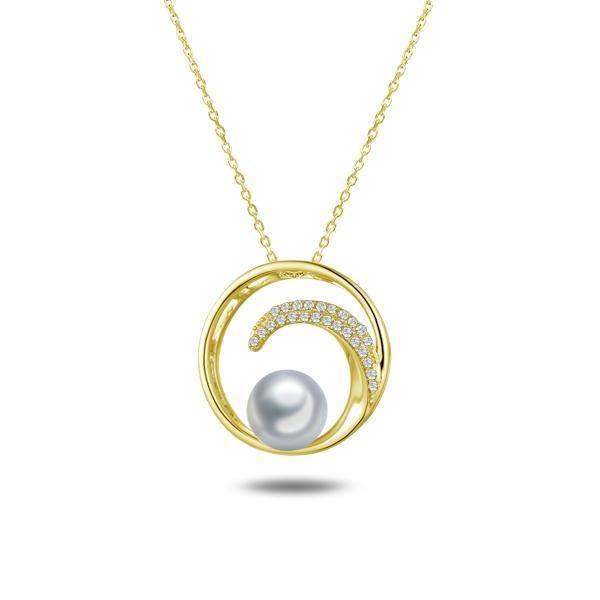 In this photo there is a yellow gold circle pendant with a wave, diamonds, and one white Akoya pearl.