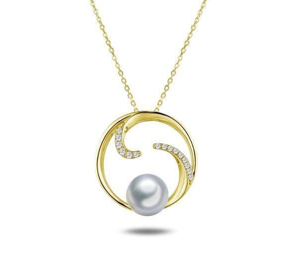 In this photo there is a yellow gold circle pendant with diamonds and one white Akoya pearl.