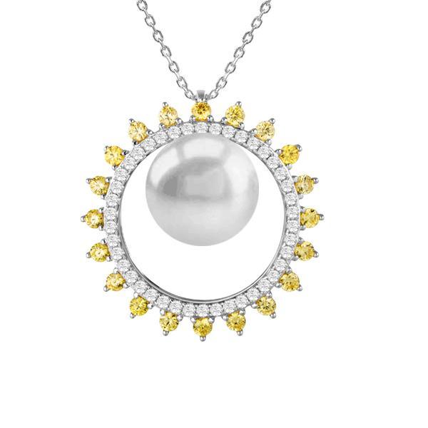 In this photo there is a white gold sun circle pendant with a white Akoya pearl and white and yellow diamonds.