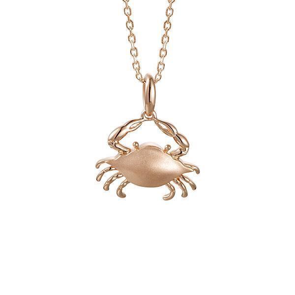 The picture shows a 14K rose gold blue crab pendant.