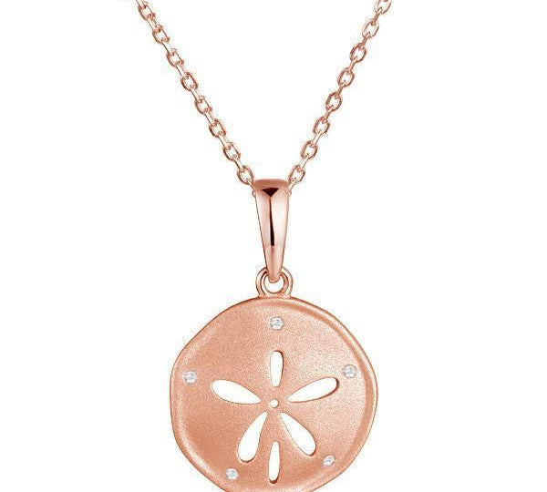 This picture shows a 14K rose gold sand dollar pendant with diamonds.