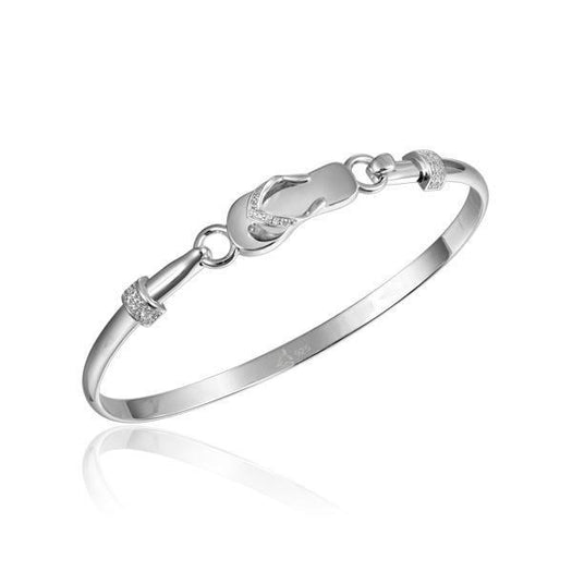 In this photo there is a 925 sterling silver slipper bangle with topaz gemstones.