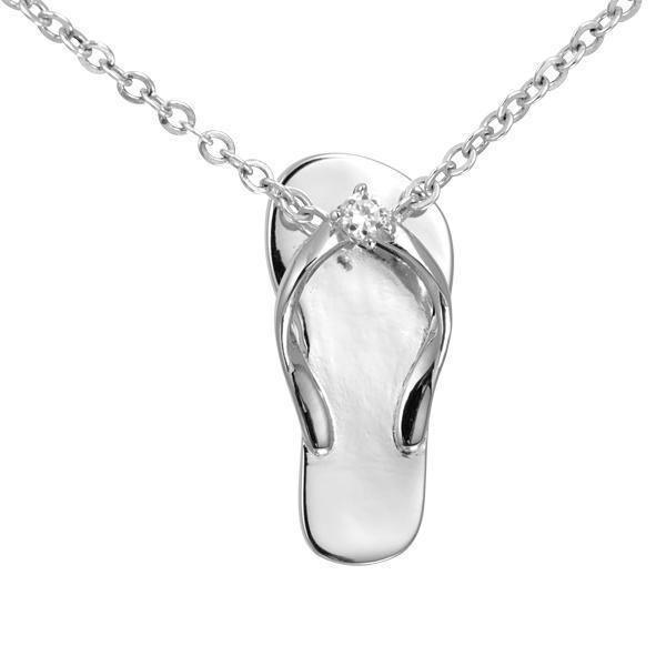 In this photo there is a sterling silver beach slipper pendant with a topaz gemstone.